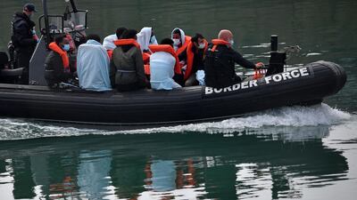 A Border Force boat packed with migrants picked up at sea in the English Channel. AFP/file