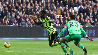 West Ham goalkeeper Alphonse Areola fouls Arsenal's Bukayo Saka to concede a penalty. Reuters