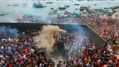 Hindu devotees celebrate Masaan or Bhasma Holi with ashes from funeral pyres, along the banks of the Ganges at Manikarnika Ghat in Varanasi, India. AFP