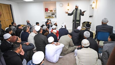 Members of the Muslim community listen to Iman Mufti Abdur-Rahman Mangera as they attend the opening of the first mosque built on the Western Isles, Stornoway, Scotland, on May 11, 2018. Jeff J Mitchell / Getty Images