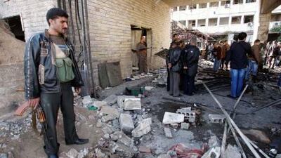 Two car bombs exploded at government buildings in Damascus yesterday, a day after Arab league monitors arrived in the Syrian Capital. Above, one of the bomb sites..