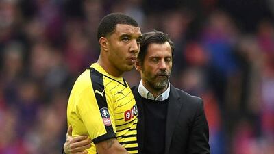 Watford striker Troy Deeney is consoled by his manager Quique Sanchez Flores after the 2-1 FA Cup semi-final defeat to Crystal Palace. Tony O'Brien / Reuters