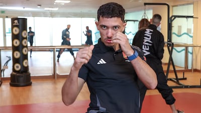 UAE's Mohamed Touizi takes on Ricardo Hilario of Portugal for the K1 continental flyweight belt in Abu Dhabi. Victor Besa / The National