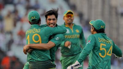 Pakistan's Mohammad Amir, face to camera, celebrates the wicket of Bangladesh's Soumya Sarkar during their ICC World Twenty20 2016 cricket match in Kolkata, India, Wednesday, March 16, 2016. (AP Photo/ Bikas Das)