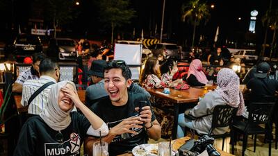Young volunteers on the campaign for Amira Aisya Abd Aziz, secretary-general of Malaysian United Democratic Alliance (MUDA), in Puteri Wangsa, Johor, Malaysia. Nearly 7 million new voters will be eligible to cast their ballots this month. Bloomberg