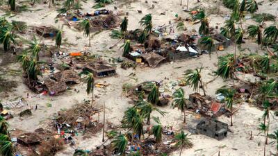 In this photo provided by the United Nations Office for the Coordination of Humanitarian Affairs (OCHA), badly damaged communities are seen from an aerial view, in Macomia district, Mozambique, Authorities have urged many residents to seek higher ground in the wake of Cyclone Kenneth as rain lashes the region. AP