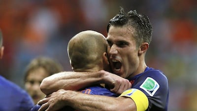 Robin van Persie and Arjen Robben embrace during Netherlands' 5-1 win over Spain at the 2014 World Cup on Friday night. Juanjo Martin / EPA