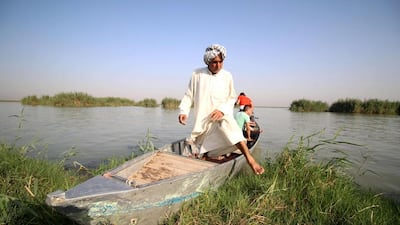 A man gets off a boat in the Ahwar area in the southern Maysan province – also known as the Iraqi Marshlands – one of the world’s largest inland delta systems. Haidar Mohammed Ali / AFP / July 14, 2016