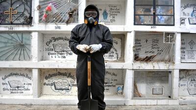 Ecuadorean Alexis Pereira, who works at the Angel Maria Canals municipal cemetery, poses in Guayaquil, Ecuador. AFP