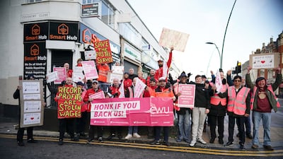Postal workers protest outside the Kilburn Delivery Office in London. PA