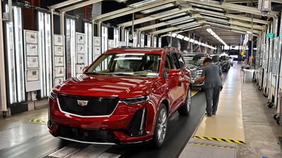 An inspection of vehicles on an assembly line at the General Motors (GM) manufacturing plant in Spring Hill, Tennessee. GM's plan to return North American plants to work later this month involves social distancing, temperature checks, regular sanitising and improved plant ventilation. Reuters