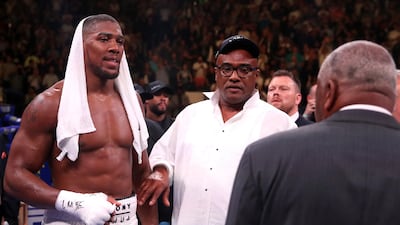 Anthony Joshua and dad Robert after the fight. PA