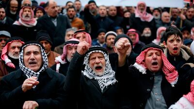 Palestinian supporters of the Islamist Hizb al-Tahrir (Liberation Party), chant slogans as they take part in a rally in the West Bank city of Hebron to protest against a US-brokered peace proposal. AFP
