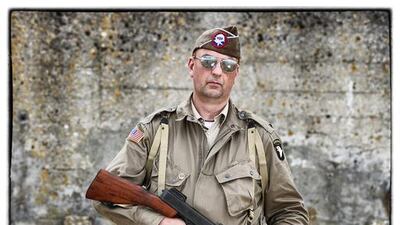 Ben Oostra, from the Netherlands, wears a replica uniform of a Paratrooper of American 101st Airborne.