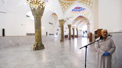A muezzin at a mosque close to shrine of Sheikh Abdul Qadir Jeelani calls for prayer in Baghdad, Iraq. Reuters