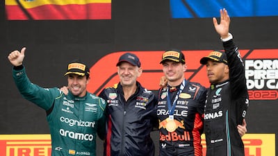 Left to right: Fernando Alonso (second place), Red Bull technical director Adrain Newey, Max Verstappen (winner) and Lewis Hamilton (third). AP