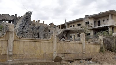 A building damaged in an air strike in Deir Ezzor, eastern Syria. the US has denied involvement in the attacks. AFP