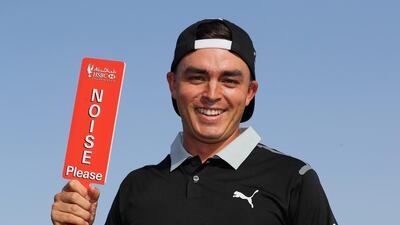 Rickie Fowler of the USA is pictured with a "Noise Please" sign during a photocall on the driving range before to the Abu Dhabi HSBC Championship at Abu Dhabi Golf Club on January 17, 2017 in Abu Dhabi, UAE. Andrew Redington / Getty Images