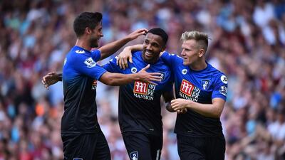 Bournemouth players (left to right) Andrew Surman, Callum Wilson and Matt Ritchie celebrate Wilson’s second goal against West Ham United at The Boleyn Ground in Upton Park, London, on August 22, 2015. AFP