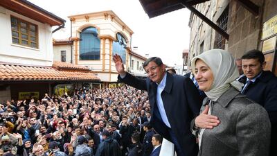 Outgoing Turkish prime minister Ahmet Davutoglu, accompanied by his wife Sare Davutoglu, greets supporters in the central Anatolian city of Konya. Hakan Goktepe / Prime Minister's Press Office