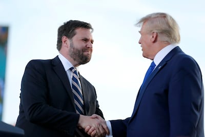 JD Vance greets former president Donald Trump at a rally at the Delaware County Fairgrounds in Delaware, Ohio. AP