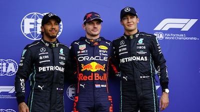 Red Bull driver Max Verstappen, centre, alongside Mercdes pair Lewis Hamilton, left, and George Russell. EPA