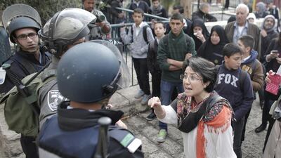 Haneen Zuabi shouts at Israeli security forces at one of the entrances to Jerusalem's Al Aqsa mosque during clashes between Israeli police and stone-throwing Palestinians on November 5, 2014. Ahmad Gharabli/AFP Photo