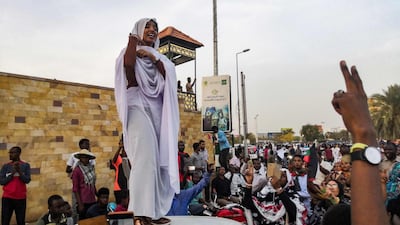 Alaa Saleh chants with protesters. AFP