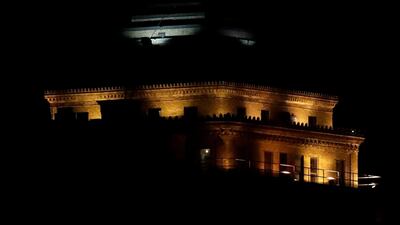 A supermoon rises in front of a replica of the Statue of Liberty sitting atop the Liberty Building in Downtown Buffalo, New York. Julio Cortez / AP Photo