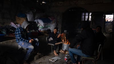 A Palestinian family on the outskirts of the Khan Younis refugee camp. AP