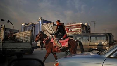 An Afghan boy rides a horse in Kabul, Afghanistan. AP Photo