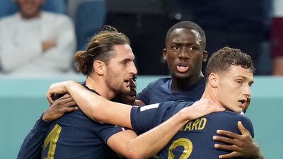 France's Adrien Rabiot, left, celebrates scoring their first with teammates Ibrahima Konate and Benjamin Pavard. PA