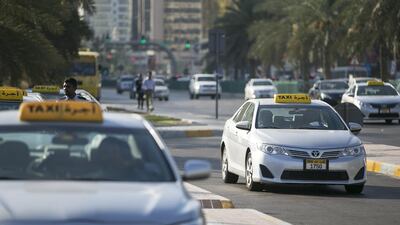 Taxi's lined up in front of Zayed Shopping Center. Abu Dhabi, United Arab Emirates (Mona Al-Marzooqi/ The National)