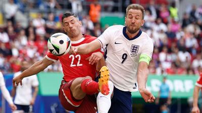 England's Harry Kane fights for the ball with Fabian Schar of Switzerland. AFP