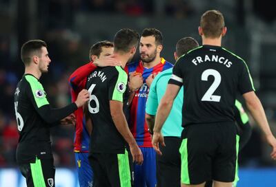 Crystal Palace's Luka Milivojevic clashes with Bournemouth's Andrew Surman. Hannah McKay / Reuters