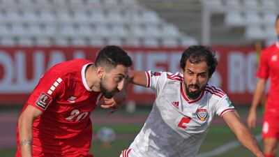 Lebanon forward Rabih Ataya battles for the ball with UAE's Mohammed Barqesh. AFP
