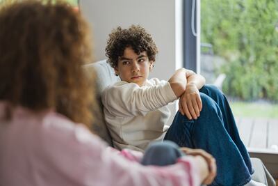 Addressing peer pressure is important when speaking to teens about cultivating positive habits. Getty Images