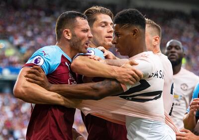 Manchester United forward Marcus Rashford, right, clashes with Burnley's Phillip Bardsley. Rashford was shown a red card for the altercation. EPA