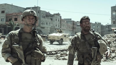 Jake McDorman and Bradley Cooper in American Sniper. Courtesy Warner Bros Pictures