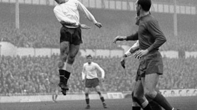 Spurs' Jimmy Greaves (left) leaps for a ball and scores in the match against West Bromwich at White Hart Lane, in 1966. PA