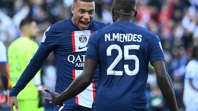 Mbappe celebrates with Nuno Mendes after opening the scoring. AFP