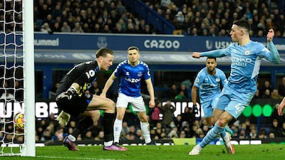 Manchester City's midfielder Phil Foden scores against Everton. AFP