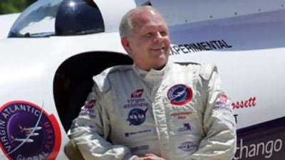 The US adventurer Steve Fossett posing next to his Virgin Atlantic Global Flyer aircraft after landing at the National Air and Space Musuem in Chantilly, Virginia.
