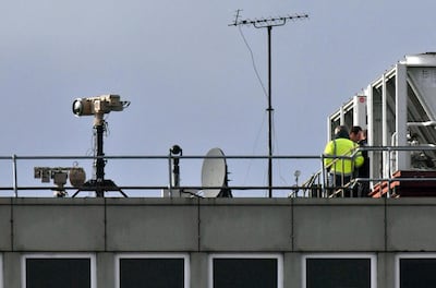 Counter drone equipment is deployed on a rooftop at Gatwick airport in England. AP