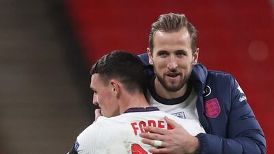 Phil Foden and Harry Kane celebrate after the match. Reuters