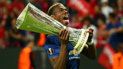Paul Pogba celebrates with the Europa League trophy after helping Manchester United to victory over Ajax. Michael Dalder / Reuters