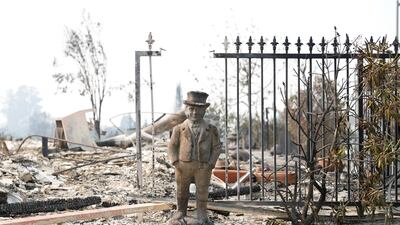 A statue stands amongst a home destroyed by the Tubbs Fire in Santa Rosa, California. Stephen Lam / Reuters