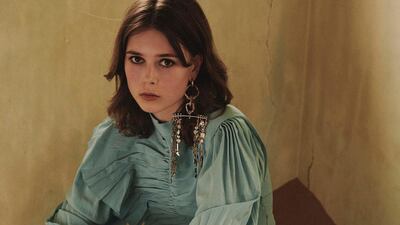 Dress, Dh28,631; earring, Dh8,300; and ring, Dh1,024, all from Givenchy. Boots, Dh2,185, Stuart Weitzman.