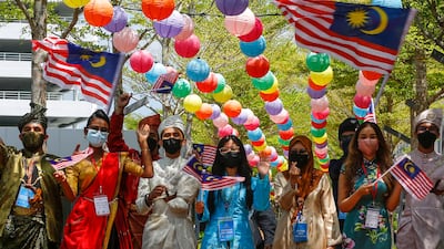 Volunteers take part in events to mark Malaysia Day. More than 76 per cent of Malaysia's adult population have been fully vaccinated against Covid-19. EPA