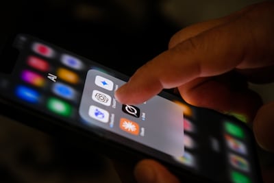 An Apple iPhone screen with icons for artificial intelligence apps. Getty Images